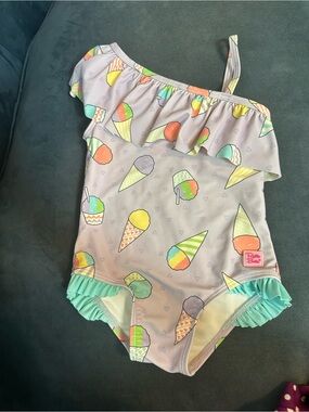 Ruffle Butts Purple Ice Cream Print Asymmetric Ruffle-Shoulder Girl’s Swimsuit